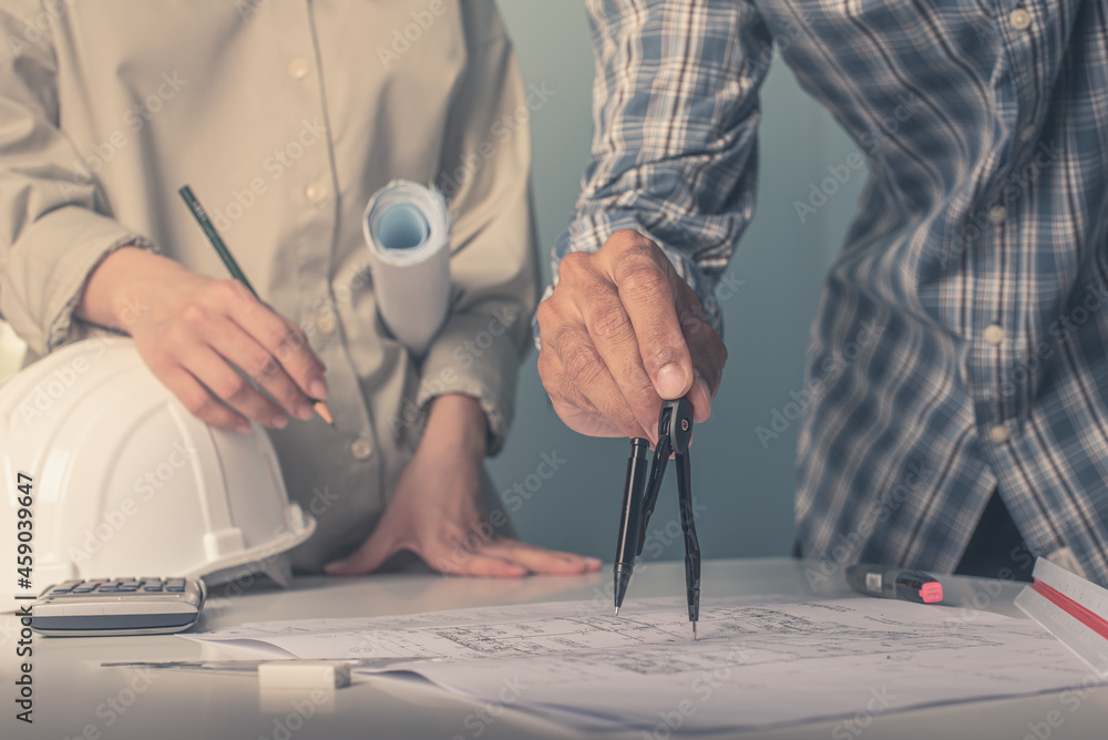 Architect working on blueprint. Architects workplace - architectural ...