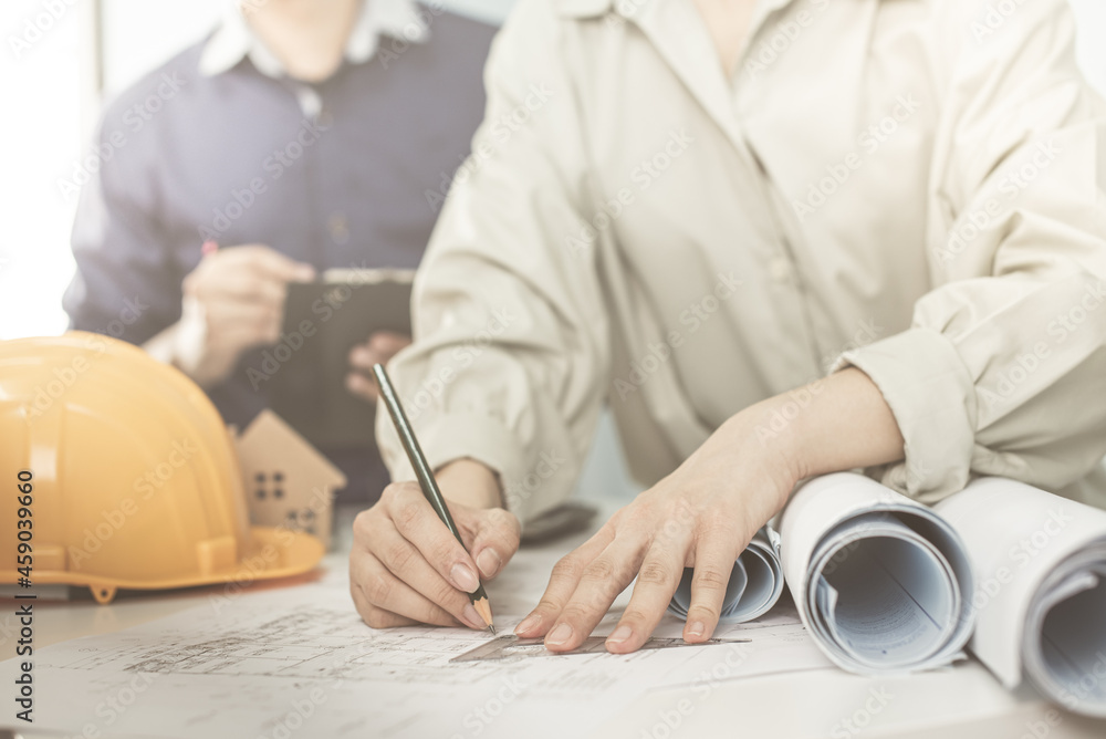Architect working on blueprint. Architects workplace - architectural ...