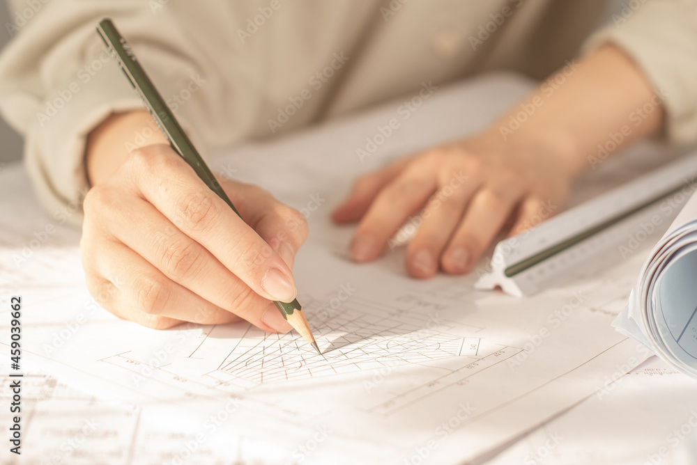 Architect working on blueprint. Architects workplace - architectural ...