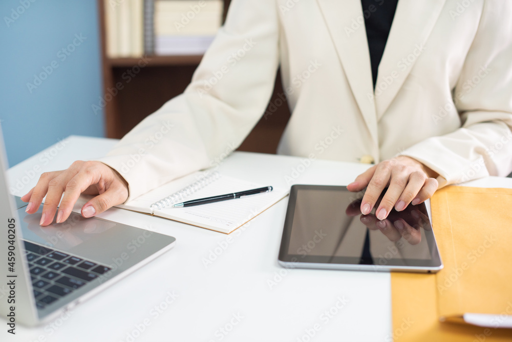 Business woman in suite working with documentary data on white desk at office, Business accounting and financial concept Business woman in suite working with documentary data on white desk at office, Business accounting and financial concept