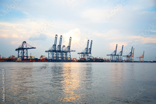 Industrial crane loading Containers in a Cargo freight ship