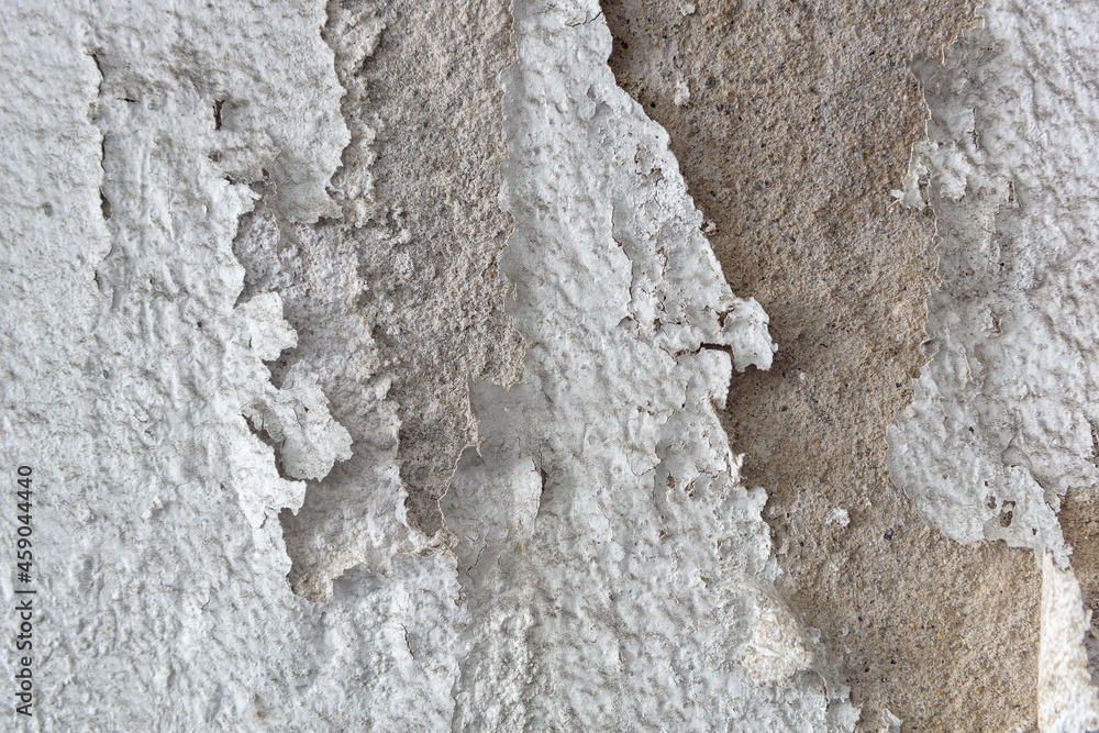 White wall with deteriorating paint for background and texture. White wall with deteriorating paint for background and texture.