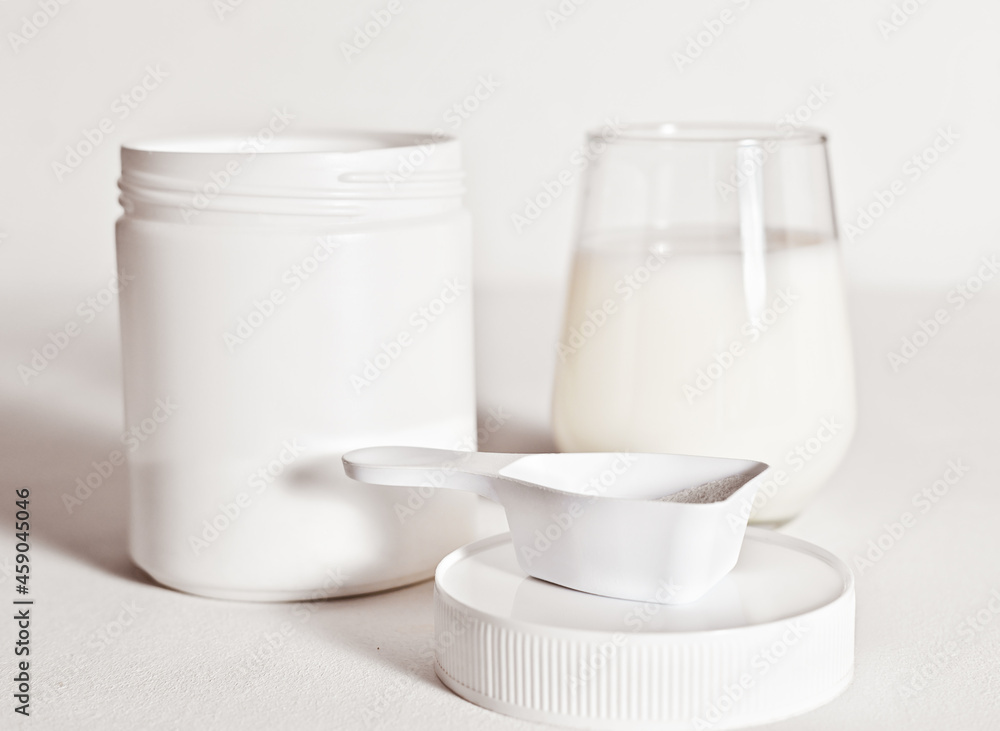 collagen peptides powder in a white unbranded container and glass with protein drink. collagen for beautiful skin and healthy joints. natural supplement for beauty care, collagen peptides powder in a white unbranded container and glass with protein drink. collagen for beautiful skin and healthy joints. natural supplement for beauty care,