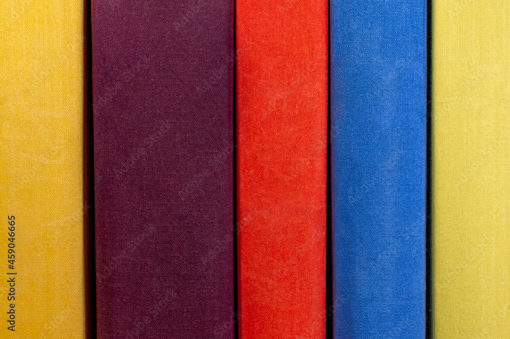 Fototapeta premium Old books in the library. Collection of old books in the closet. Education, reading, science and literature. Hobby. Beautiful cover.