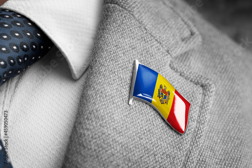 Metal badge with the flag of Moldavia on a suit lapel