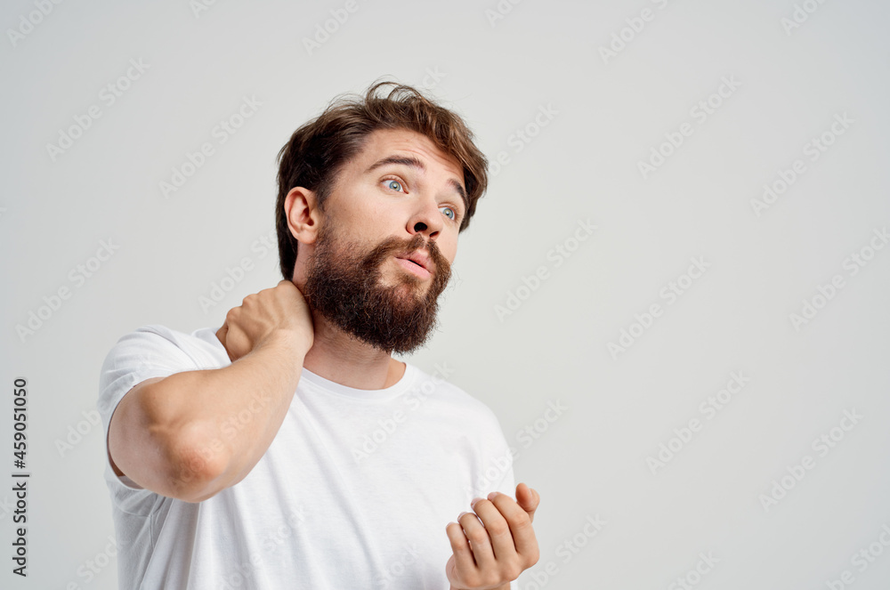 emotional man pain in the neck health problems massage therapy light background emotional man pain in the neck health problems massage therapy light background