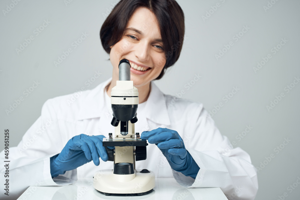 female scientist in white coat laboratory microscope science experiment female scientist in white coat laboratory microscope science experiment
