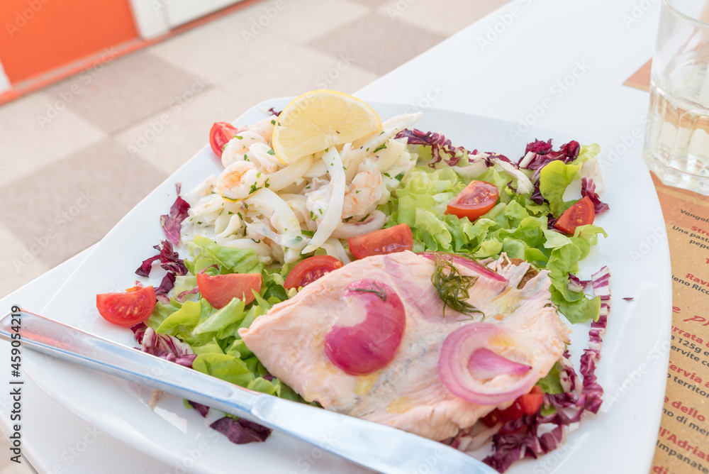 Seafood salad with salmon and vegetables
