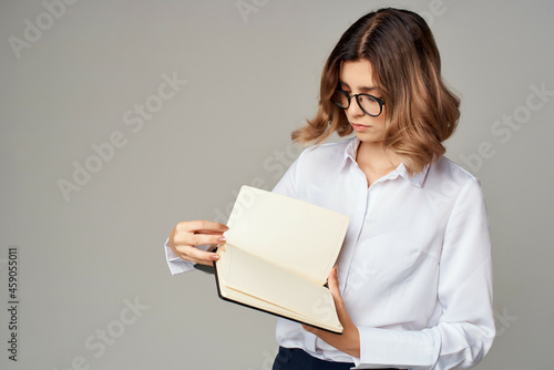 Business woman with notepad in hands professional office official