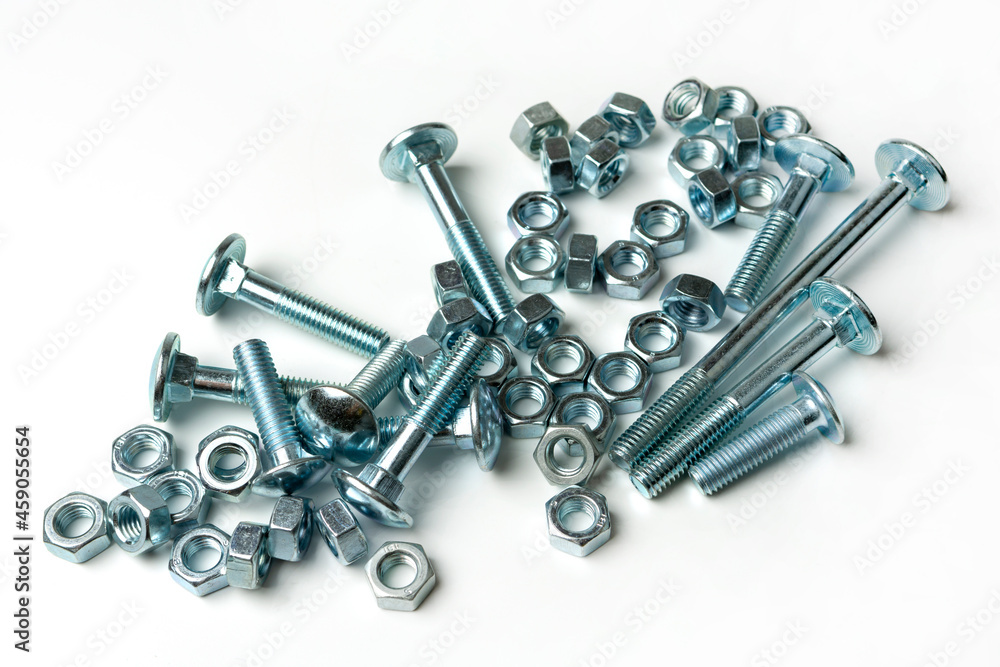 a large pile of bolts with nuts on a white background a large pile of bolts with nuts on a white background