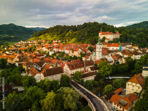 Skofja Loka Cityscape and Medieval Loka Castle in Slovenia. Aerial Drone View