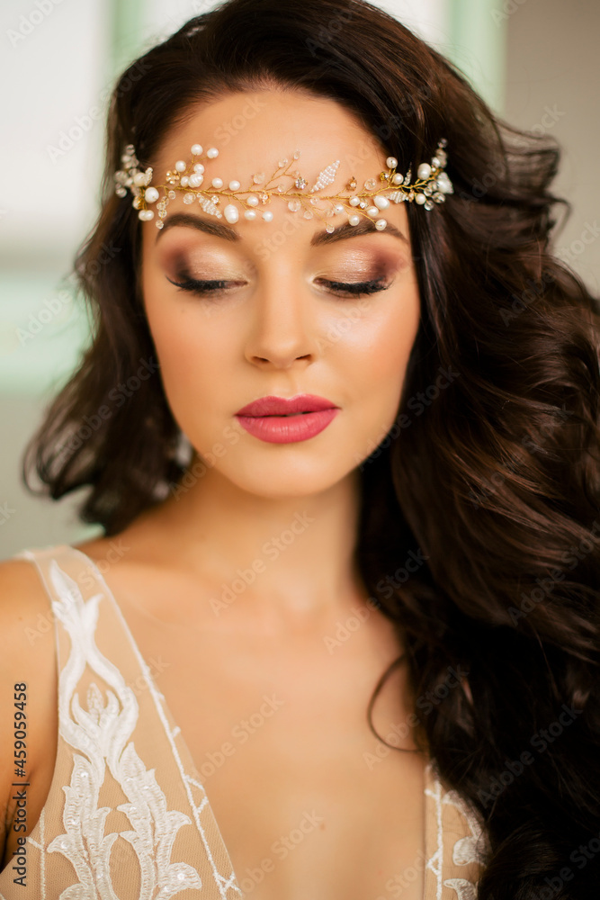 Beautiful young woman in a sexy dress Portrait of a brunette Wedding day