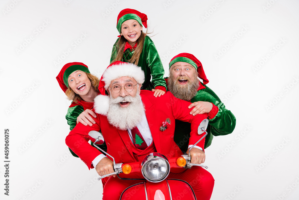 Portrait of attractive cheerful four people riding scooter having fun December winter isolated over white color background Portrait of attractive cheerful four people riding scooter having fun December winter isolated over white color background