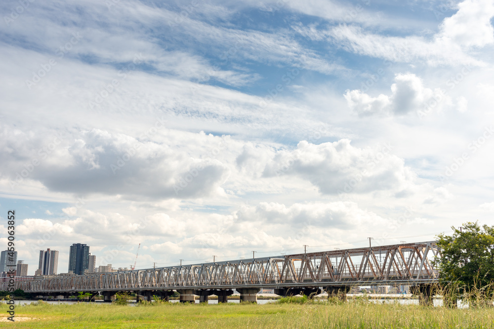 View of office buildings of central Osaka city from Yodogawa river bank View of office buildings of central Osaka city from Yodogawa river bank