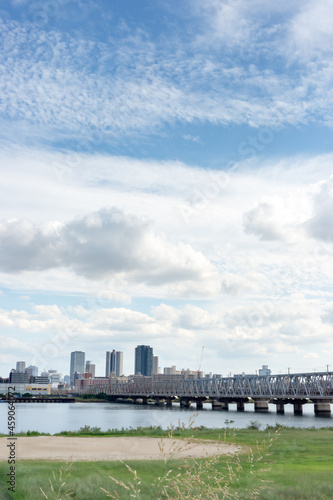 View of office buildings of central Osaka city from Yodogawa river bank photo