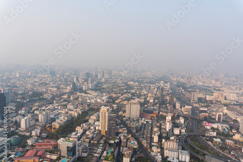 Landscape of the top view Bangkok metropolis Thailand with the dirty clouds air pollution problem. full of tower and buildings in business area
