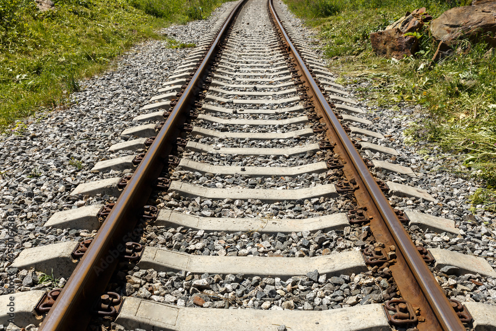 Railroad in the mountains. Railroad tracks and concrete sleepers. Railroad in the mountains. Railroad tracks and concrete sleepers.