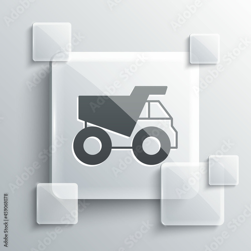 Grey Mining dump truck icon isolated on grey background. Square glass panels. Vector