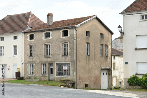 old. abandoned shop in the small French village of Voisey in the French region Champagne Ardenne in summer