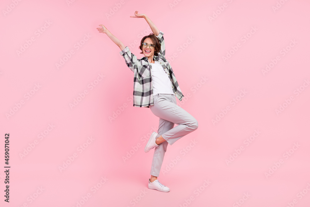 Full length photo of young cheerful woman happy positive smile have fun dancer isolated over pink color background Full length photo of young cheerful woman happy positive smile have fun dancer isolated over pink color background