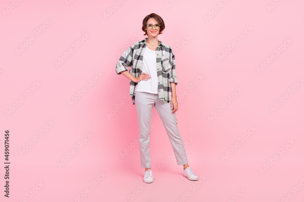 Full length photo of young attractive woman happy positive smile cool wear glasses isolated over pink color background Full length photo of young attractive woman happy positive smile cool wear glasses isolated over pink color background