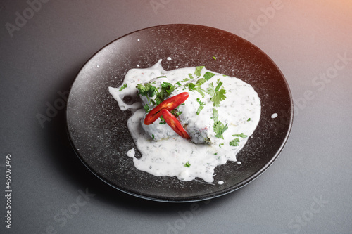 traditional georgian food gebjalia with matsoni cheese and red chili pepper photo