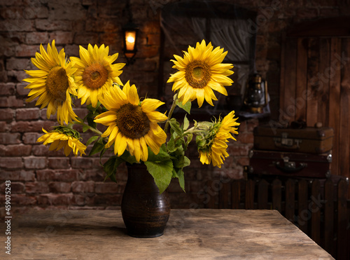 Wallpaper Mural Beautiful bouquet of sunflowers in vase on a wooden table Torontodigital.ca