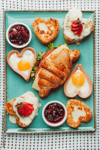 croissant with jam and cream, breakfast