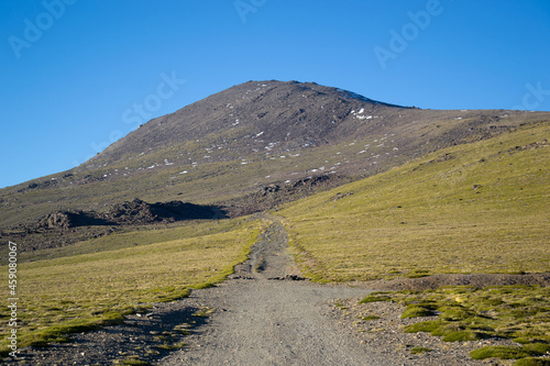 High mountain landscape called Alto del Chorrillo in Sierra Nevada with roads going up to Mulhacen