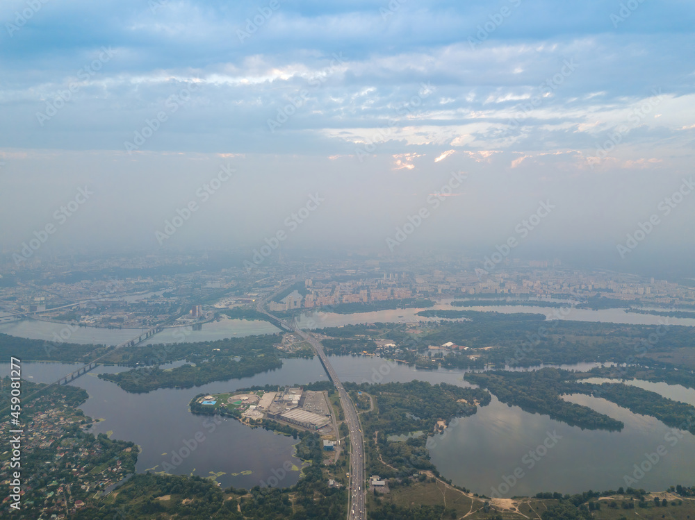 Sunset over Kiev. Cloudy evening. Aerial drone view.