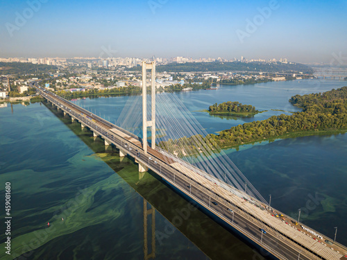 South bridge in Kiev. Algae bloom in the water of the Dnieper River. Aerial drone view.