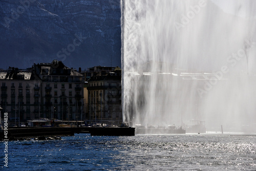 Jet d'Eau fountain (powered by jet engine) on Lake Geneva, city center of Geneva, Saleve mountain (in France) in background, Switzerland, Europe