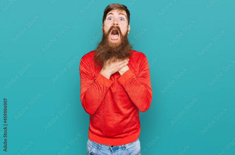 Redhead man with long beard wearing casual clothes shouting and suffocate because painful strangle. health problem. asphyxiate and suicide concept. Redhead man with long beard wearing casual clothes shouting and suffocate because painful strangle. health problem. asphyxiate and suicide concept.