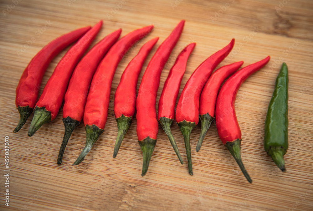 red hot chili peppers on wooden background red hot chili peppers on wooden background