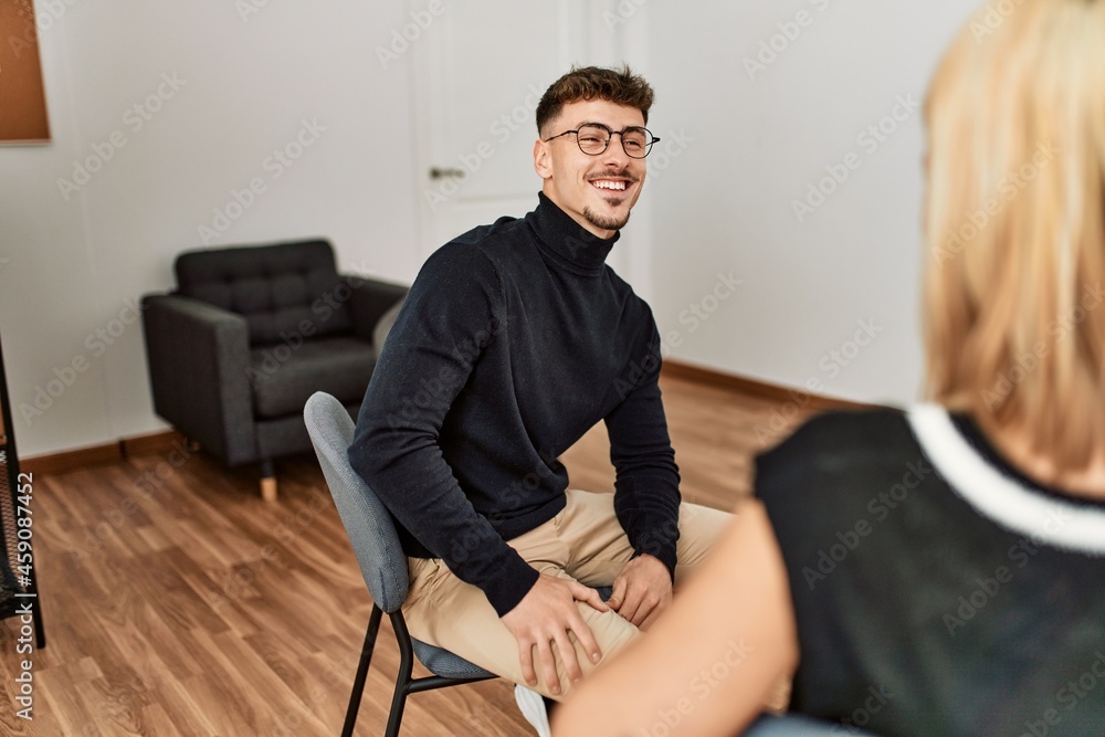 Fototapeta premium Two business workers smiling happy working at the office.