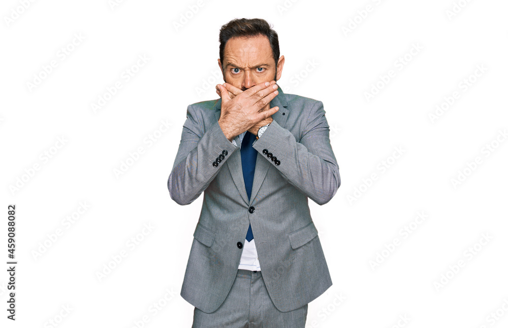 Middle age man wearing business clothes shocked covering mouth with hands for mistake. secret concept. Middle age man wearing business clothes shocked covering mouth with hands for mistake. secret concept.