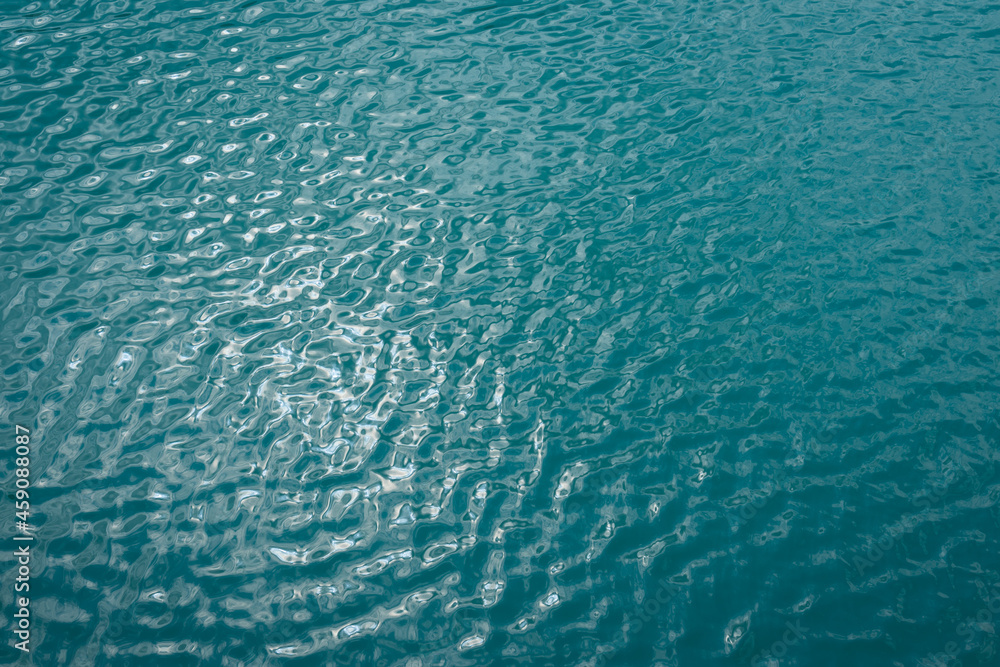 turquoise blue water texture and reflections of sunlight abstract nature background for relaxation turquoise blue water texture and reflections of sunlight abstract nature background for relaxation