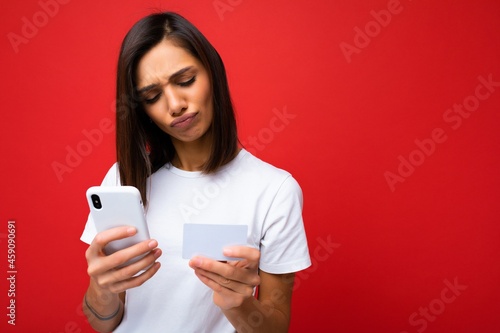 Quadro su tela Pretty concentrated woman wearing everyday stylish clothes isolated on backgroun