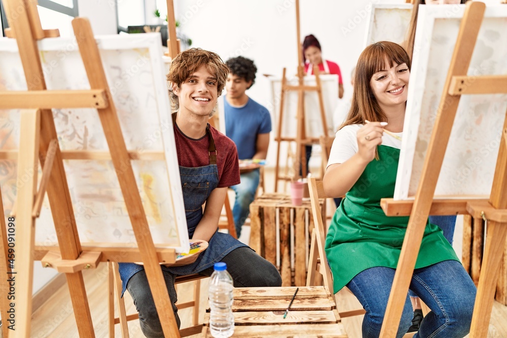 Group of young draw students smiling happy drawing at art studio. Group of young draw students smiling happy drawing at art studio.