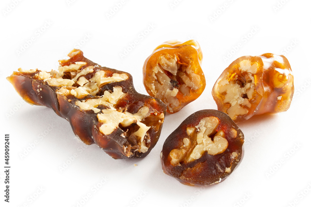 Walnuts on a string dipped in starch grape molasses. Churchkhela. Walnut sujuk. Walnuts on a string dipped in starch grape molasses. Churchkhela. Walnut sujuk.