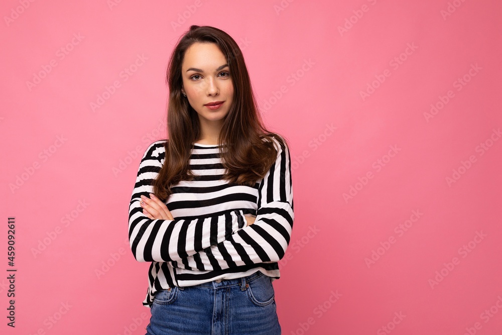Portrait of positive cheerful fashionable woman in casual clothes isolated on pink background with copy space Portrait of positive cheerful fashionable woman in casual clothes isolated on pink background with copy space