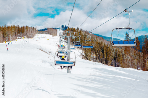 Ski slope resort . Ski Lift Connection . Snowy mountains and forest  © russieseo