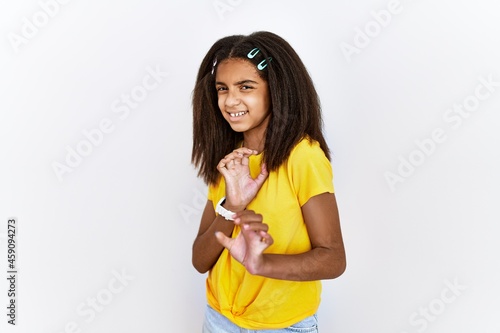 Young african american girl standing over white isolated background disgusted expression, displeased and fearful doing disgust face because aversion reaction. with hands raised