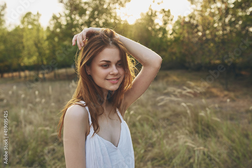 cheerful woman nature freedom in the field walk fresh air