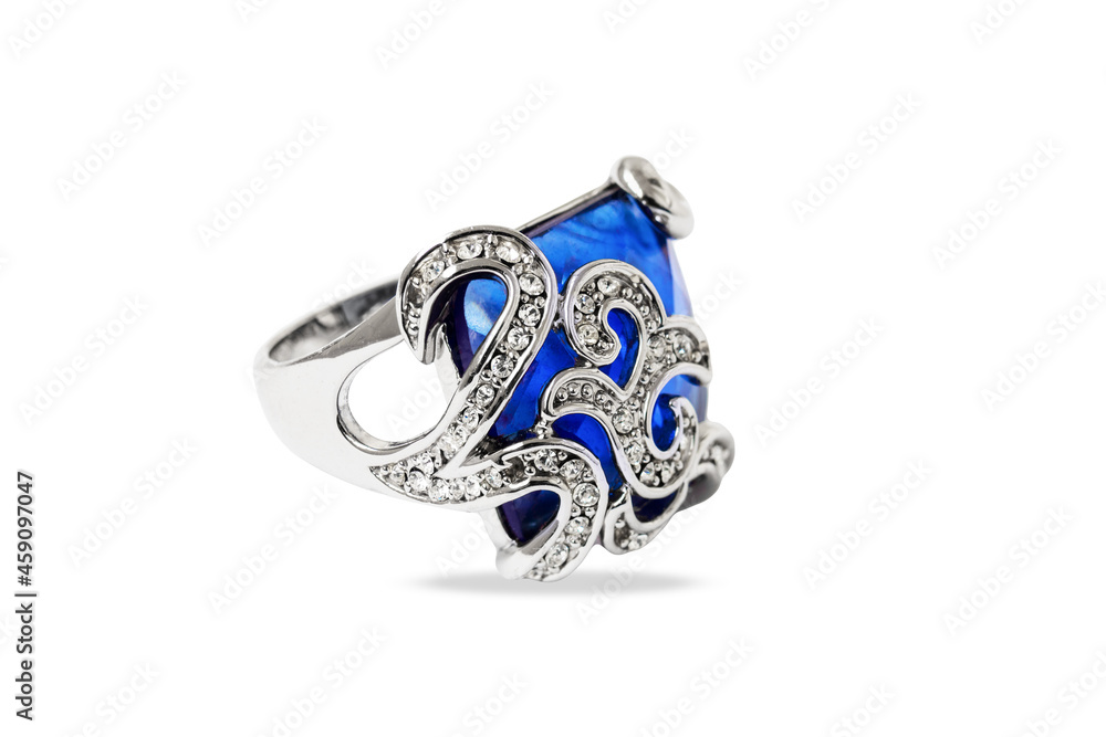 Precious white metal ring with blue stone and small diamonds, close-up, isolated on white background Precious white metal ring with blue stone and small diamonds, close-up, isolated on white background
