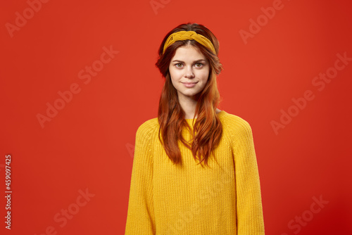 cheerful pretty woman in yellow sweater red hair hippie fashion