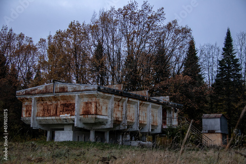 strange rusty abandoned observatory building on concrete pillars