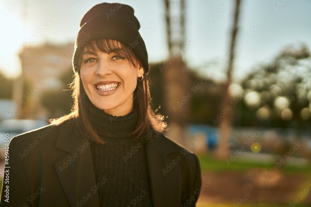 Young hispanic woman smiling happy standing at the city. Young hispanic woman smiling happy standing at the city.