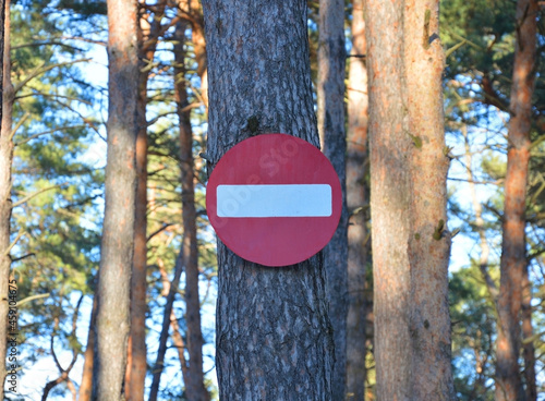 Obraz na plátně stop sign no entry into the forest on a pine tree