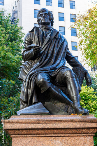 Robert Burns (Rabbie Burns) statue in Savoy Place London England UK the Scottish poet who wrote Auld Lang Syne, which is a popular tourist holiday travel destination landmark of the city photo